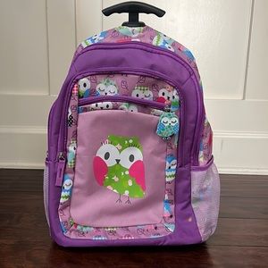 Brand New kid rolling backpack in purple. Cute owl prints Easy clean material.